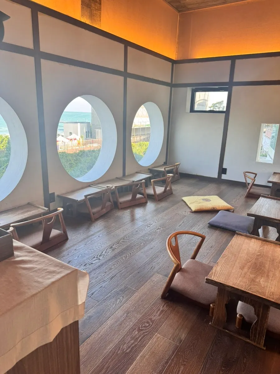 Interior decor at Suwolgyeonghwa featuring displayed teacups