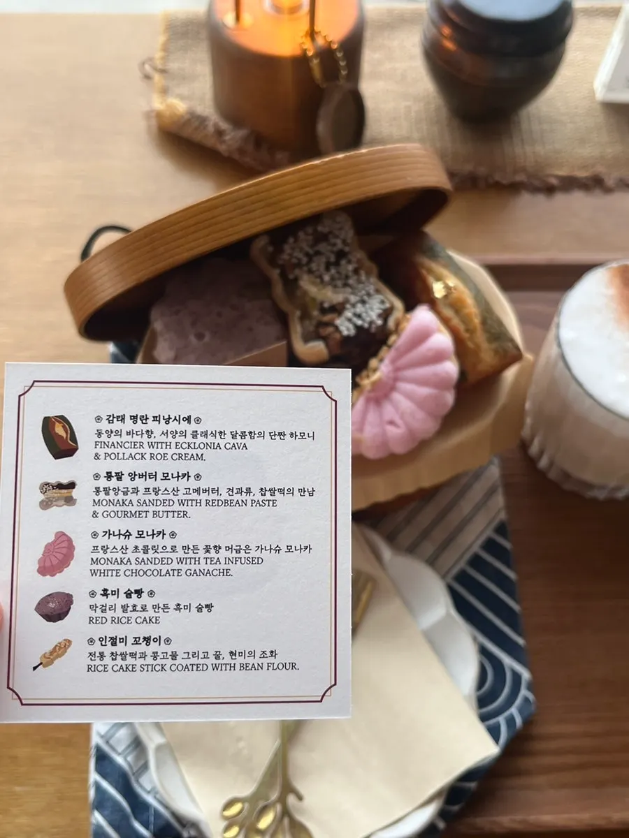 Window-side table at Suwolgyeonghwa with tea and an ocean view