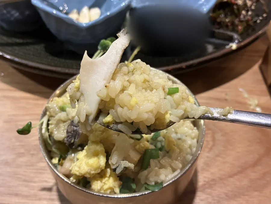 Pot rice mixed with scrambled egg and abalone innards sauce