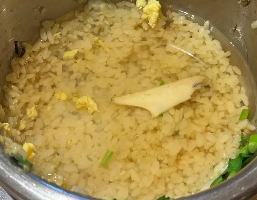 Crispy leftover rice with seafood broth poured over it