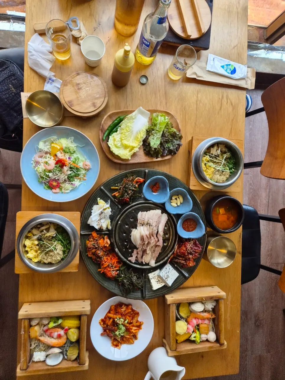 Table set with salad and seasoned squid