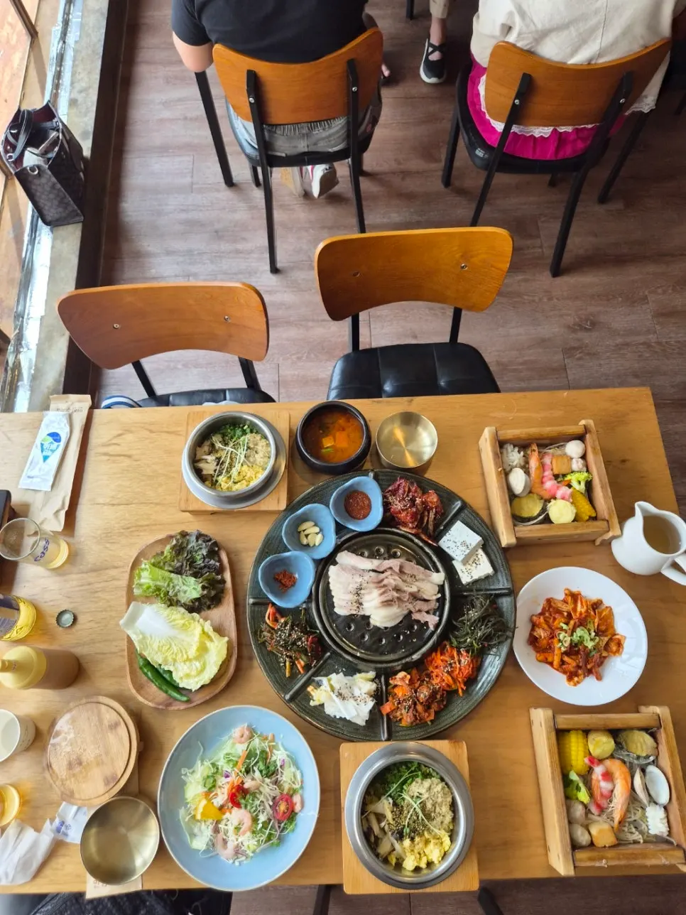 Korean side dishes of kimchi and seasoned greens