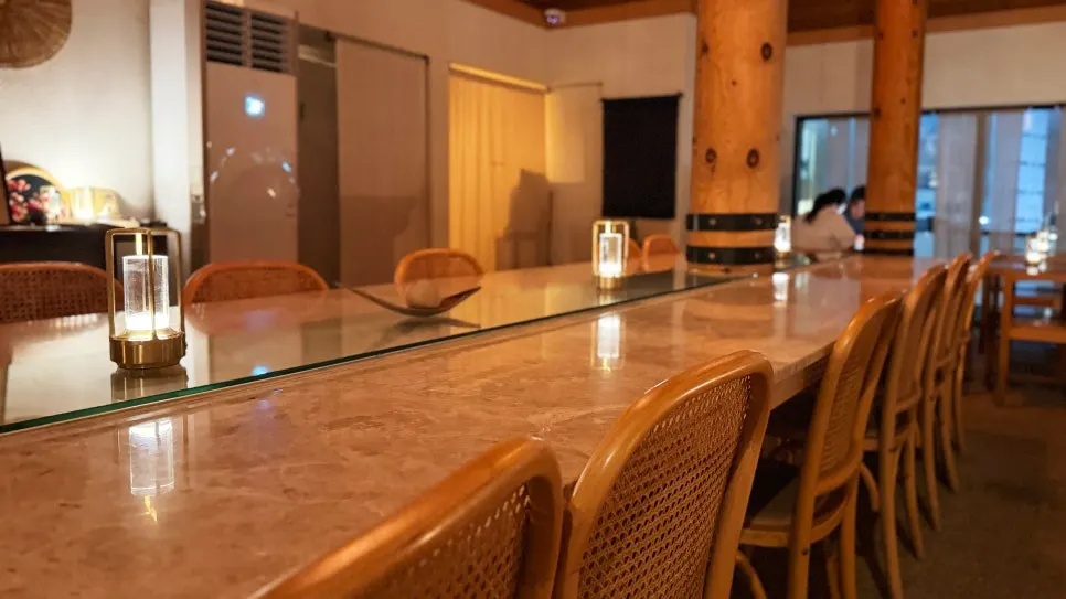 Interior of the café with a view of Songjeong Beach at night
