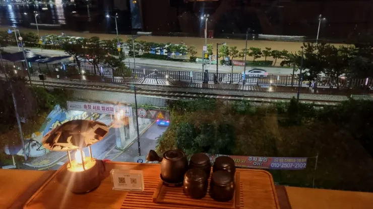 4th floor seating at Suwolgyeonghwa with a night-view atmosphere