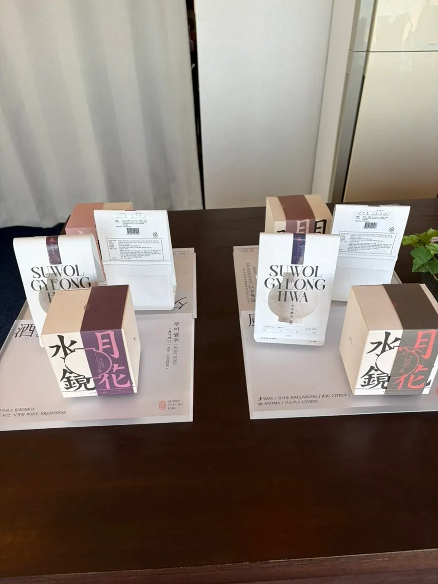 Tea packages in various flavors including Melon Mance