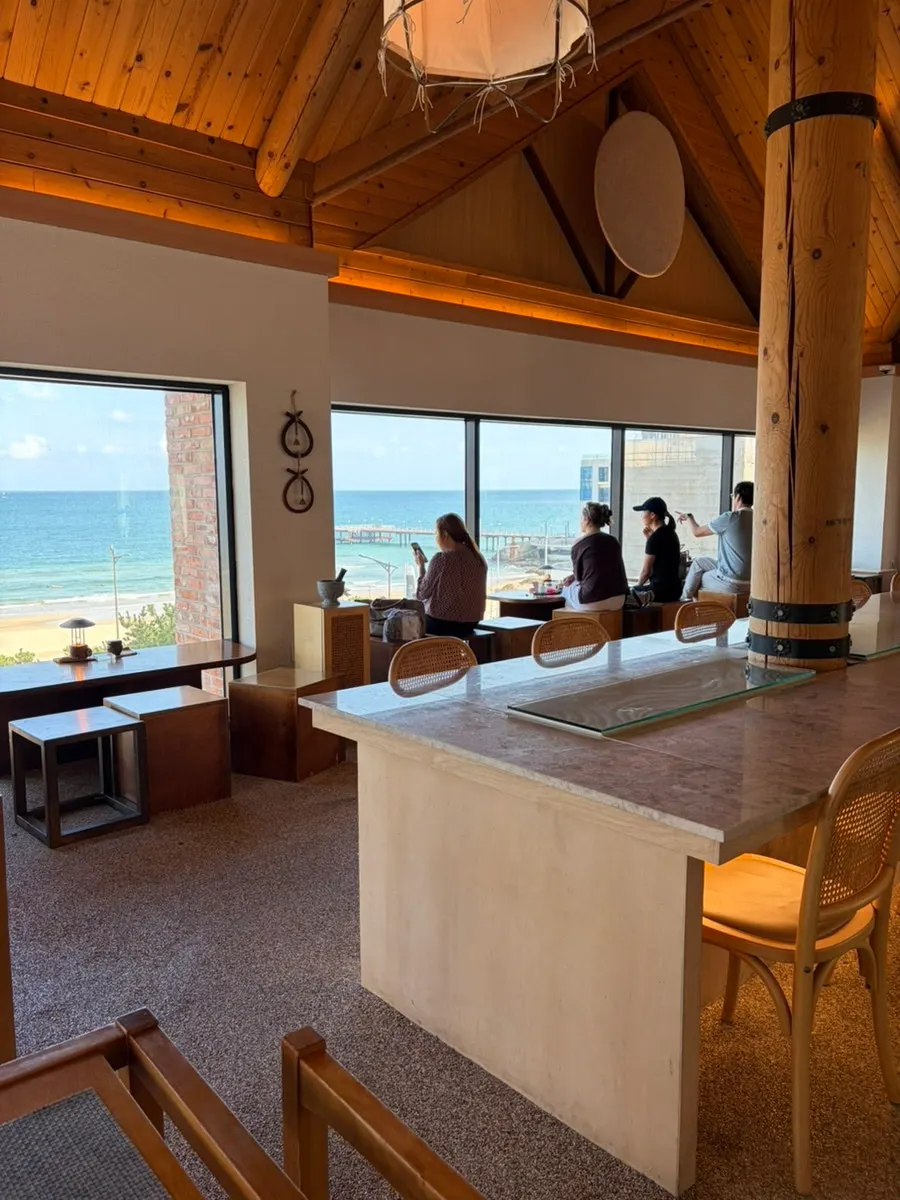 Guests seated at the ocean-view window seats