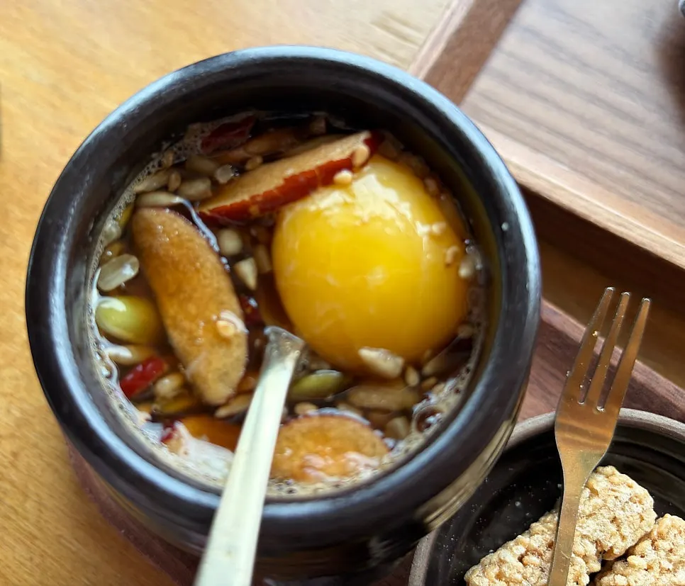 Close-up of ssanghwacha topped with egg yolk