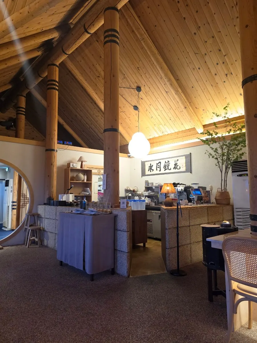 Interior with wood-toned tables and chairs
