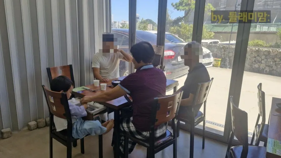 Five-person seating by the window at the back