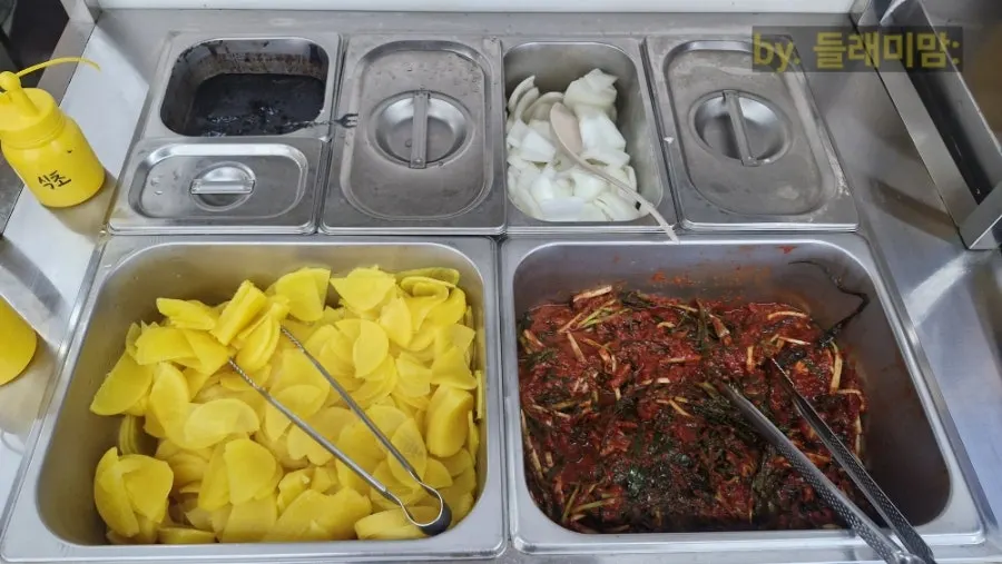 Self-service bar with black bean paste and green-onion kimchi