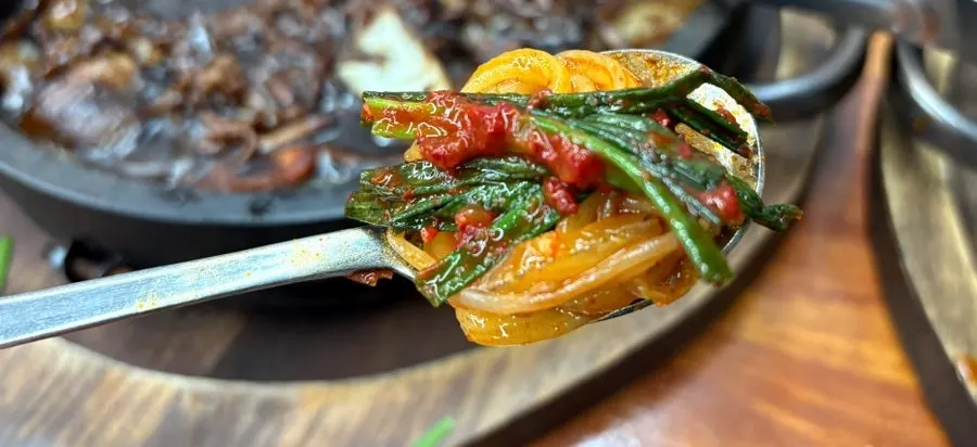 Green onion kimchi served alongside the dol jjamppong