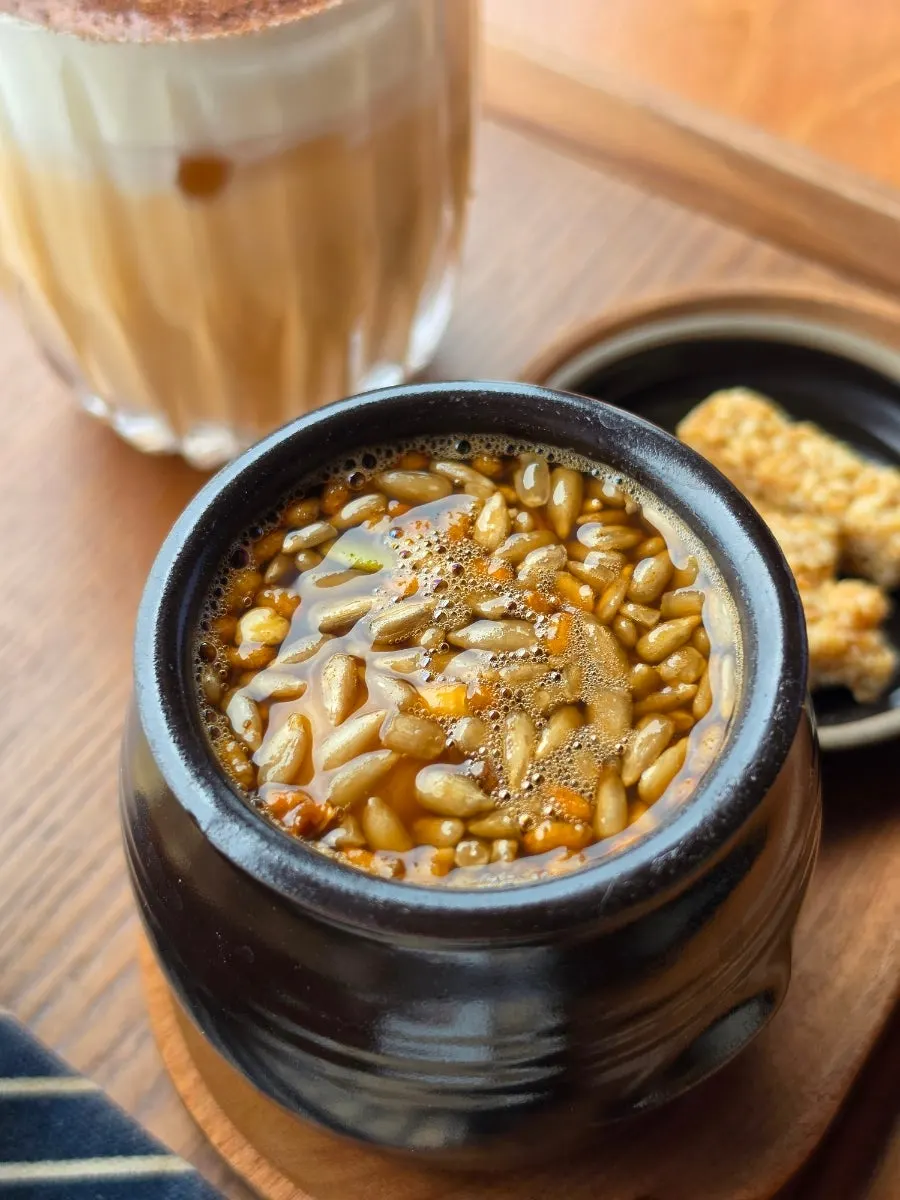 Egg yolk inside the ssanghwacha jar topped with pine nuts