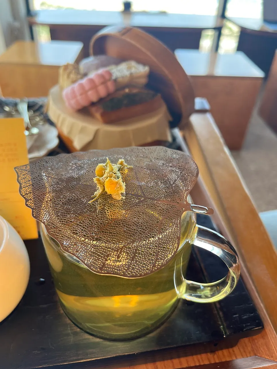 A cup of hojigabae with the sea in the background