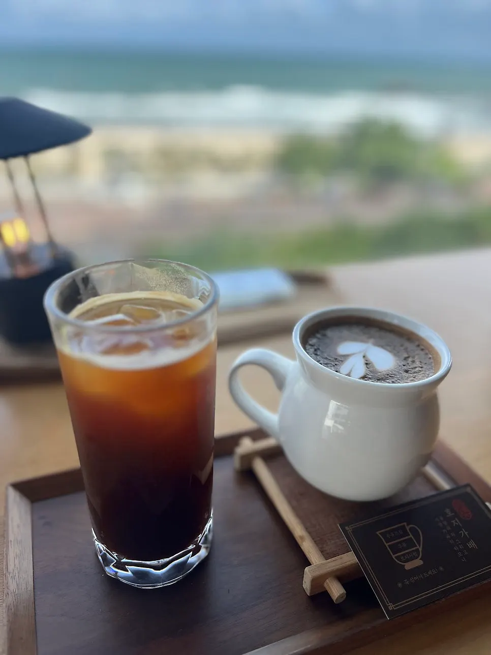 Caffeine-free chamomile elixir and iced Americano