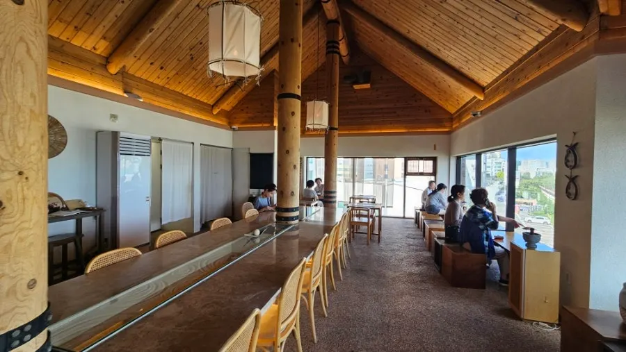 Wood-toned interior view of Suwolgyeonghwa café