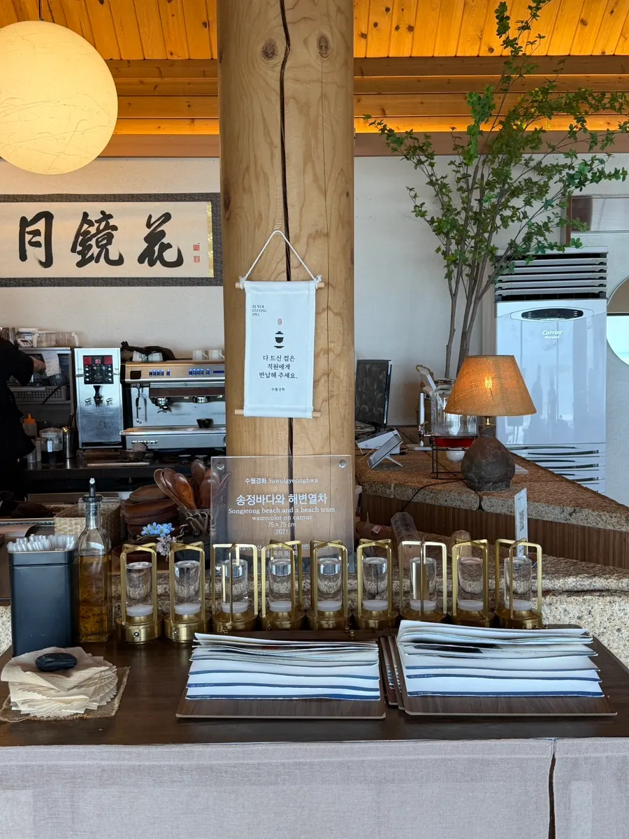 Window-side ocean-view seating at Suwolgyeonghwa