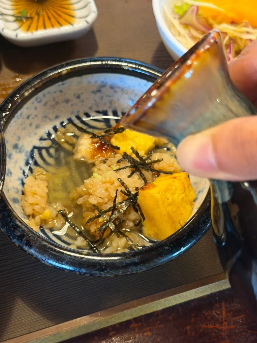 A bowl of eel rice portioned out for ochazuke