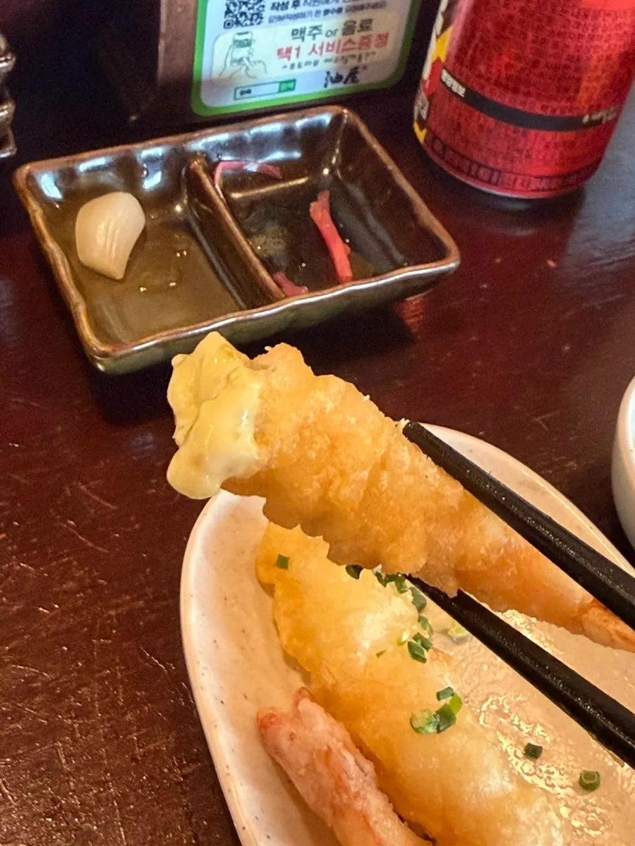 Fried shrimp served with tartar and chili sauce