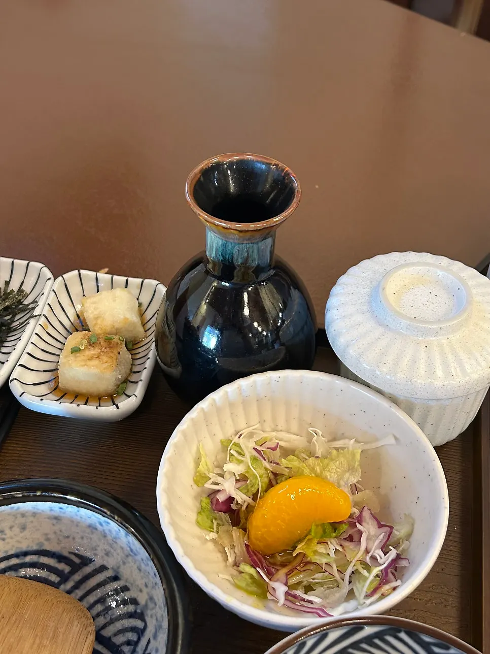 A bottle of green tea for ochazuke and the appetizer salad