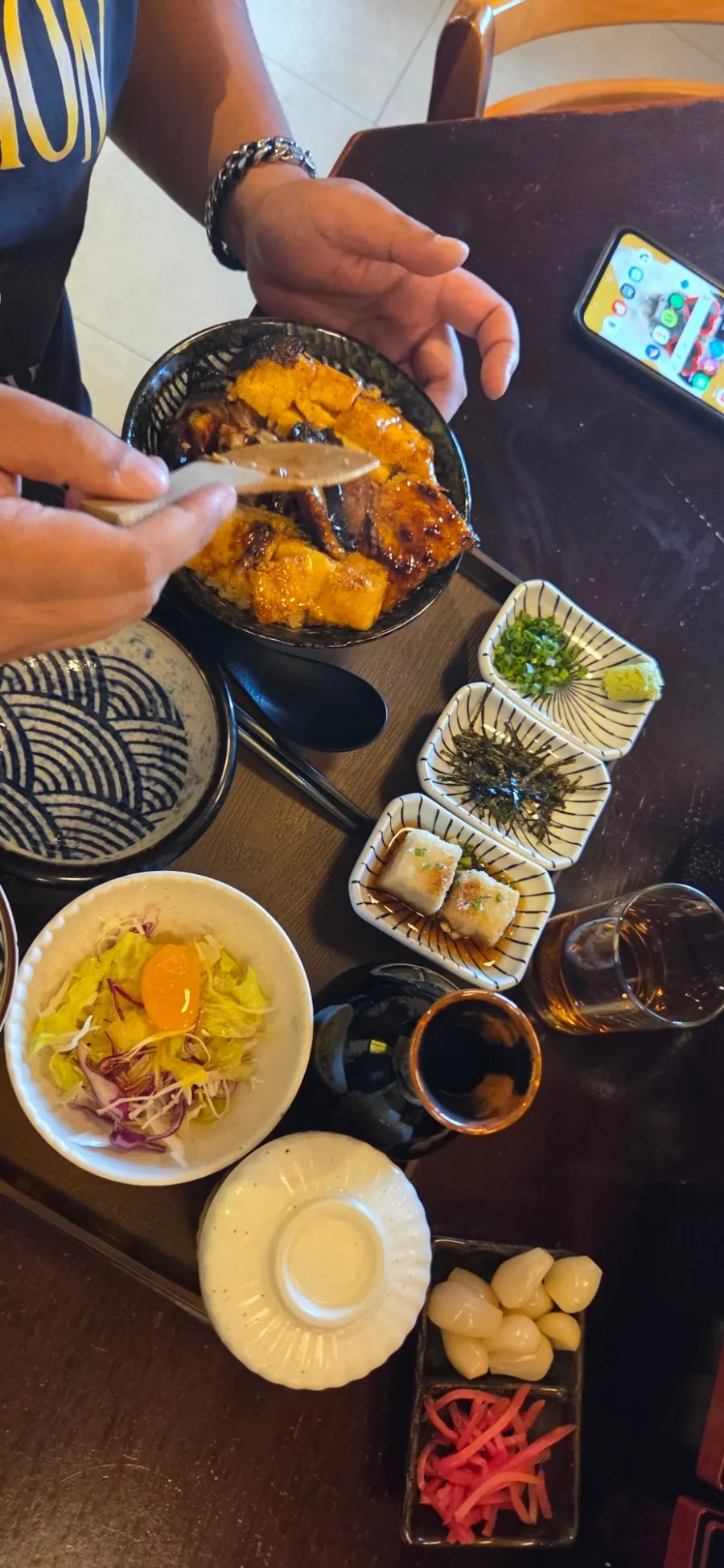 Kimchi and pickled radish served with the fried shrimp udon