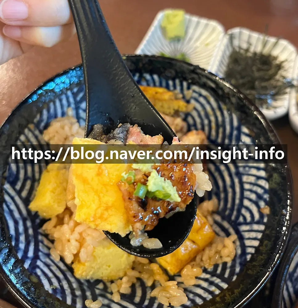 Thick Japanese-style rolled egg hidden under the eel
