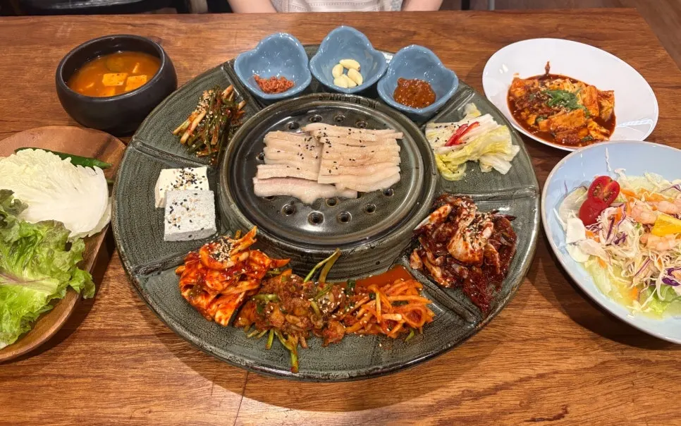 Table set with gabrisal bossam and side dishes