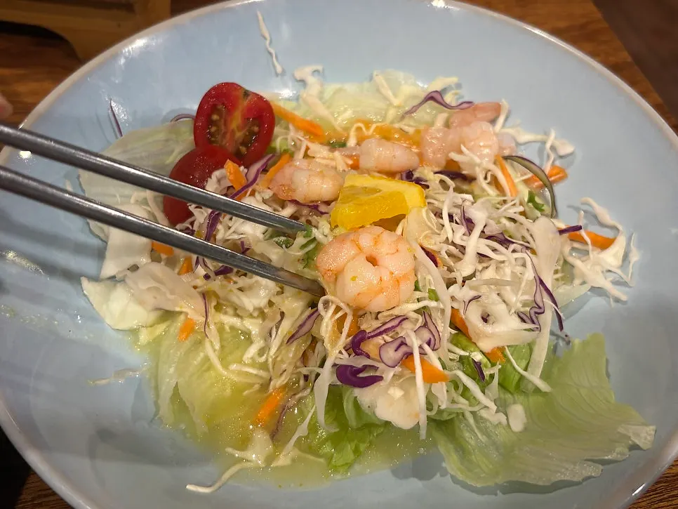 Lettuce wraps and side dishes served with bossam
