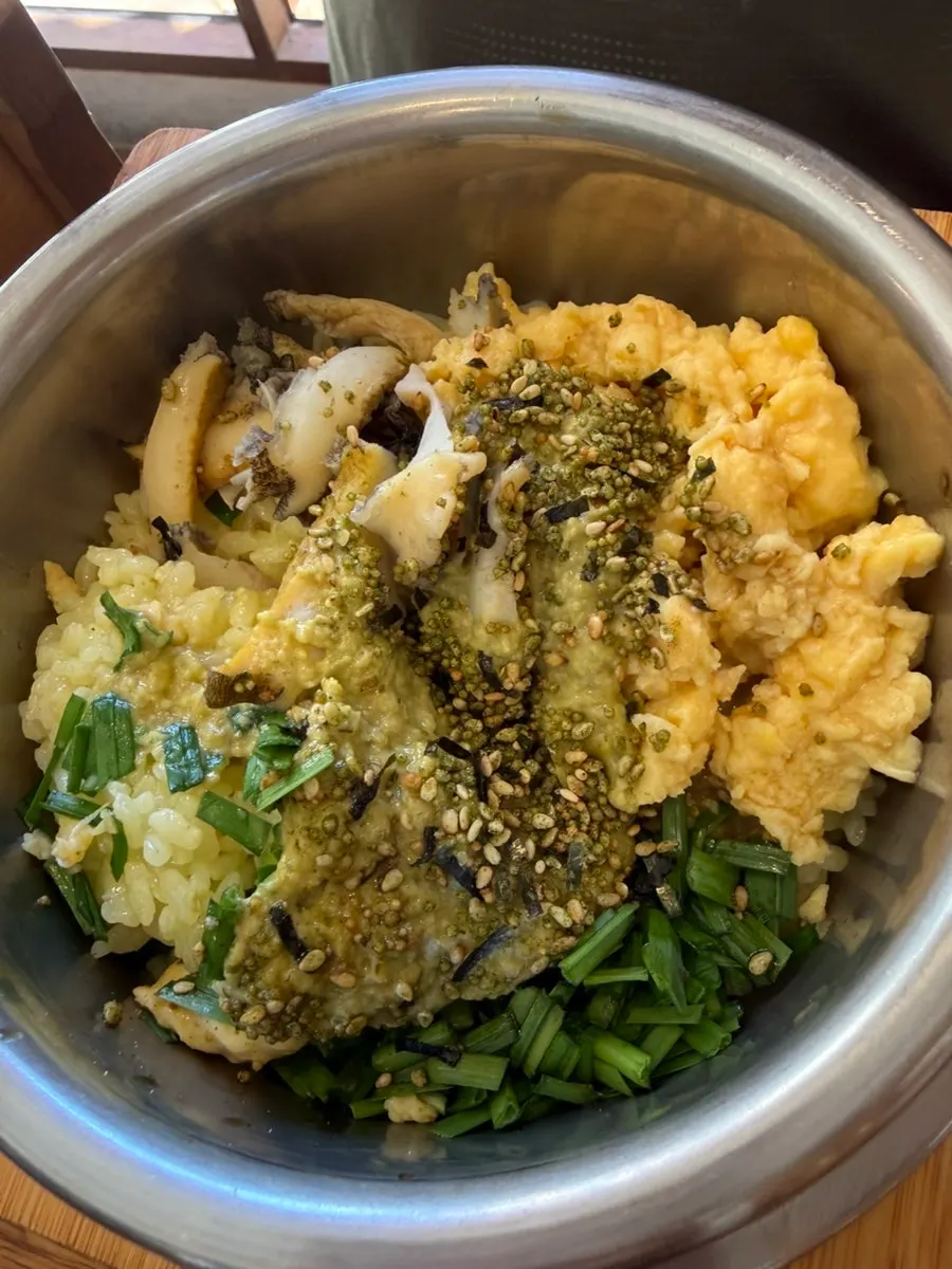 Pot rice topped with scrambled egg, green onion, and abalone innard sauce