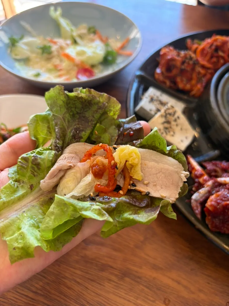 Wrapping pork jowl with seafood and radish salad