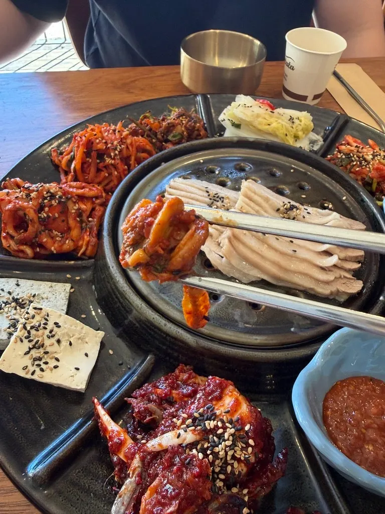 Several side dishes of seafood accompaniments