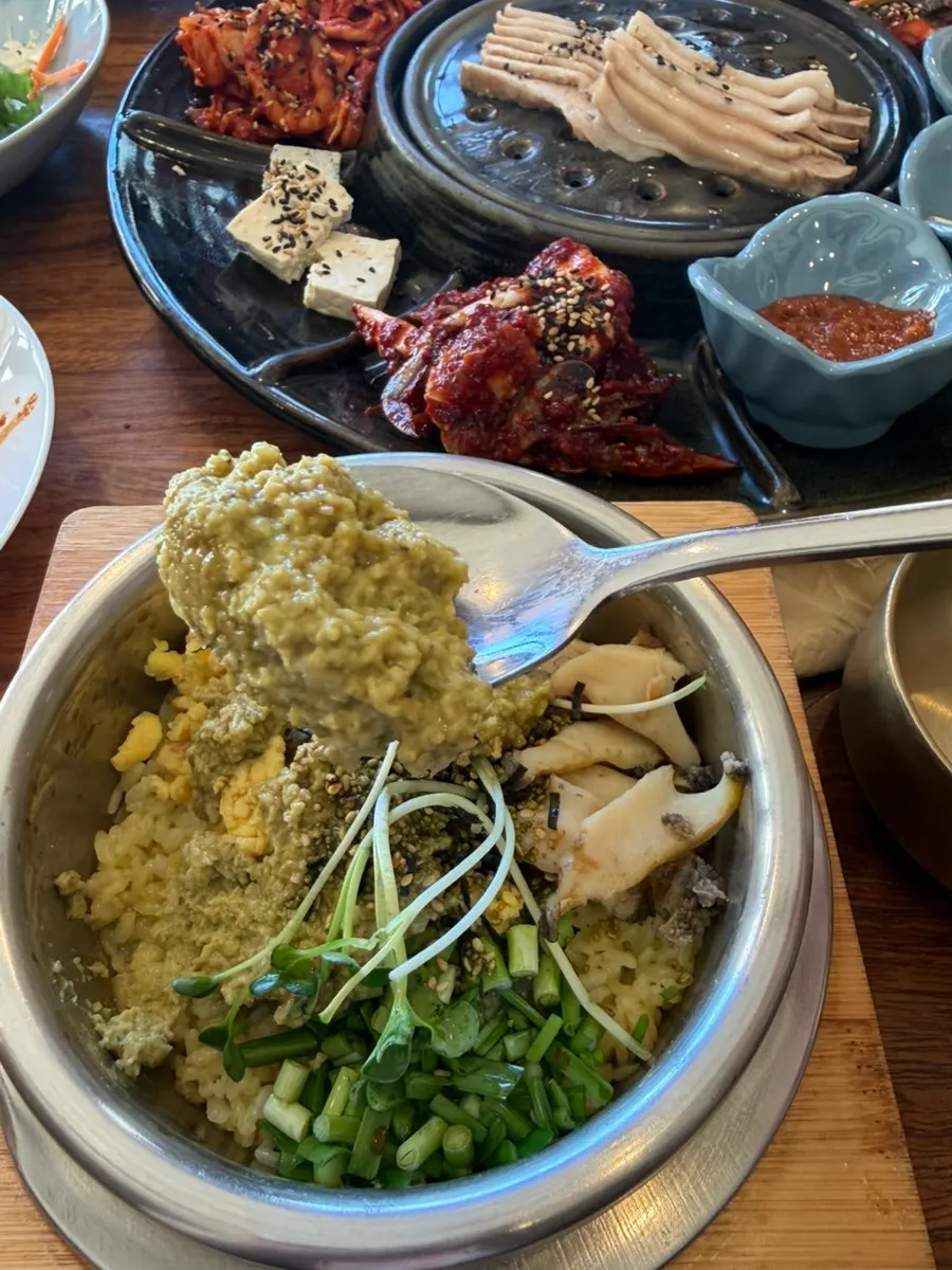 Abalone pot rice mixed and scooped into a bowl