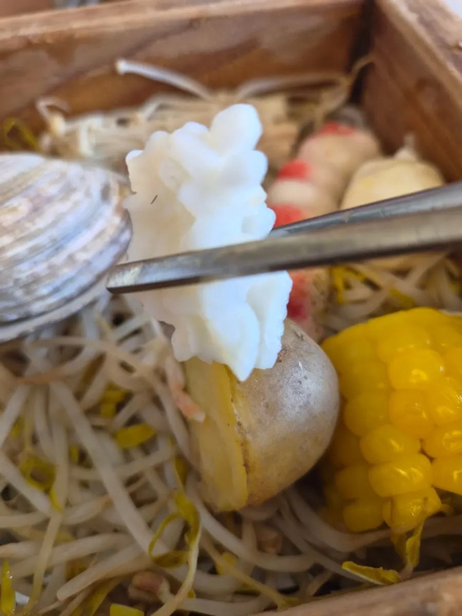 Various seafood on top of the hinoki steam