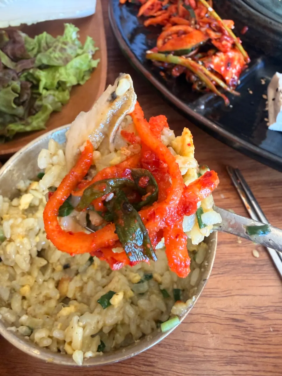 Stuffed kimchi placed on top of the abalone pot rice