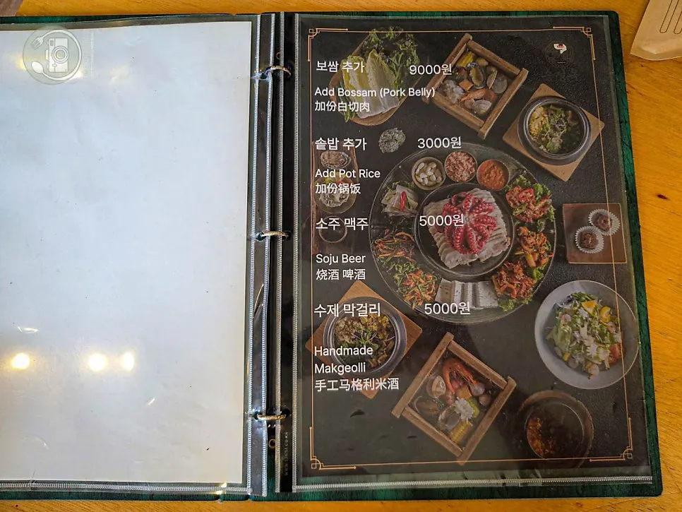 Menu board showing the price of the abalone pot rice set