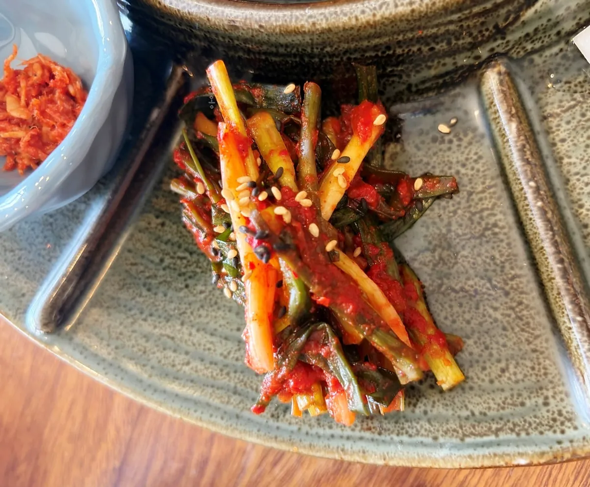 Songjeongok's pork jowl bossam served with side dishes