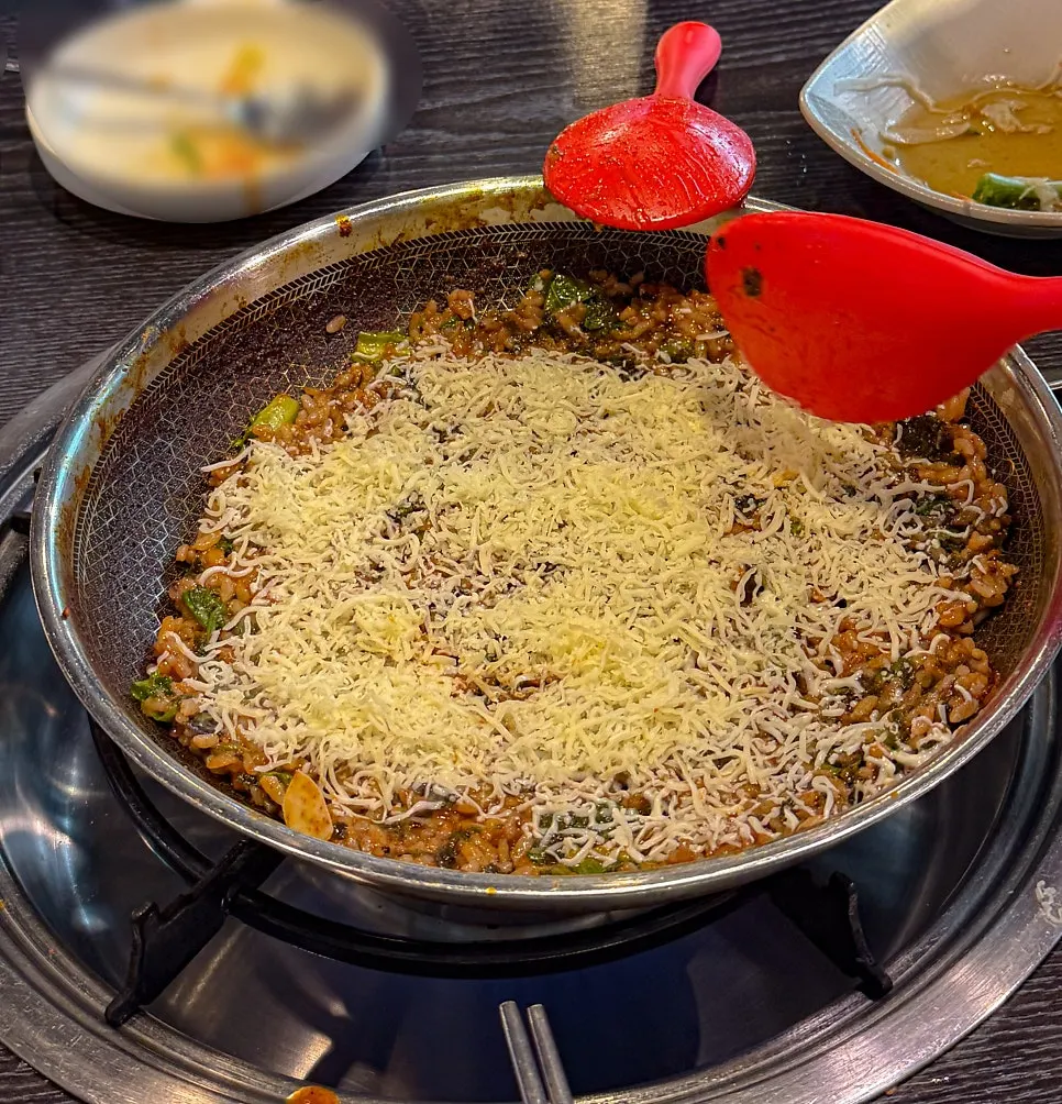Fried rice topped generously with snow cheese