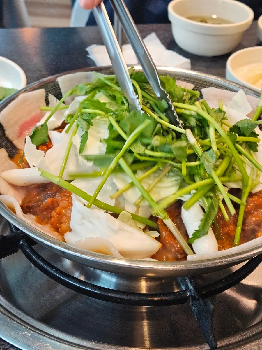 Snow cheese and mixed extras piled on top of the octopus