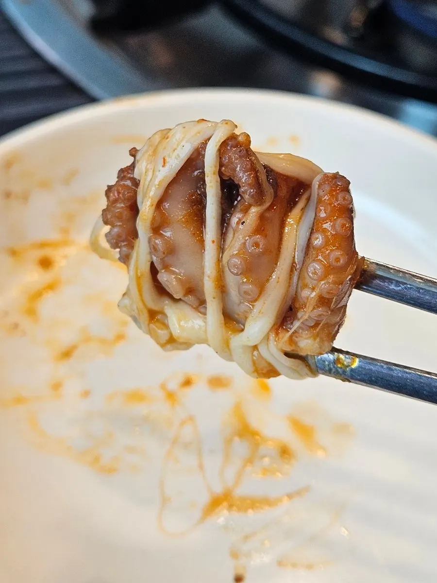 Octopus scooped from one side without mixing all the cheese together