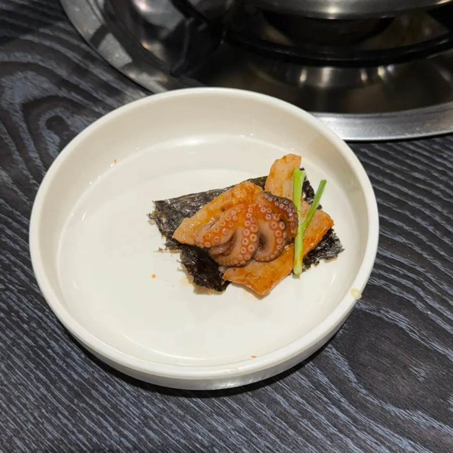 Perilla leaf wrap with jjukkumi, flying fish roe, and mayonnaise