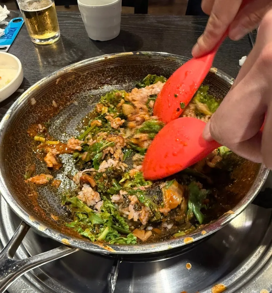 Steamed egg puffed up over the rim of its stone pot