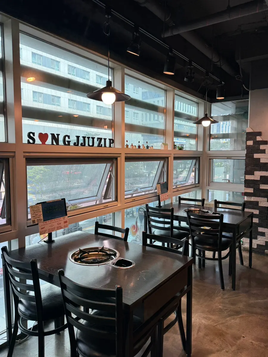 Spacious interior and seating at Songjjujip Magok