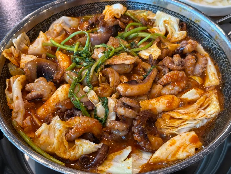 Octopus and pork belly stir-fried by staff