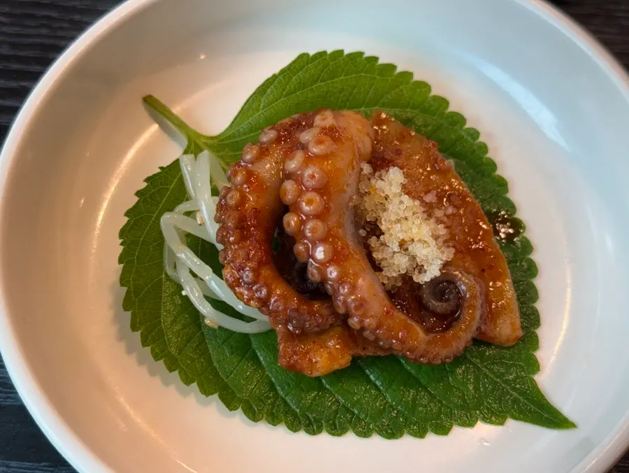 Octopus wrapped in perilla leaf with flying fish roe and dipping sauce