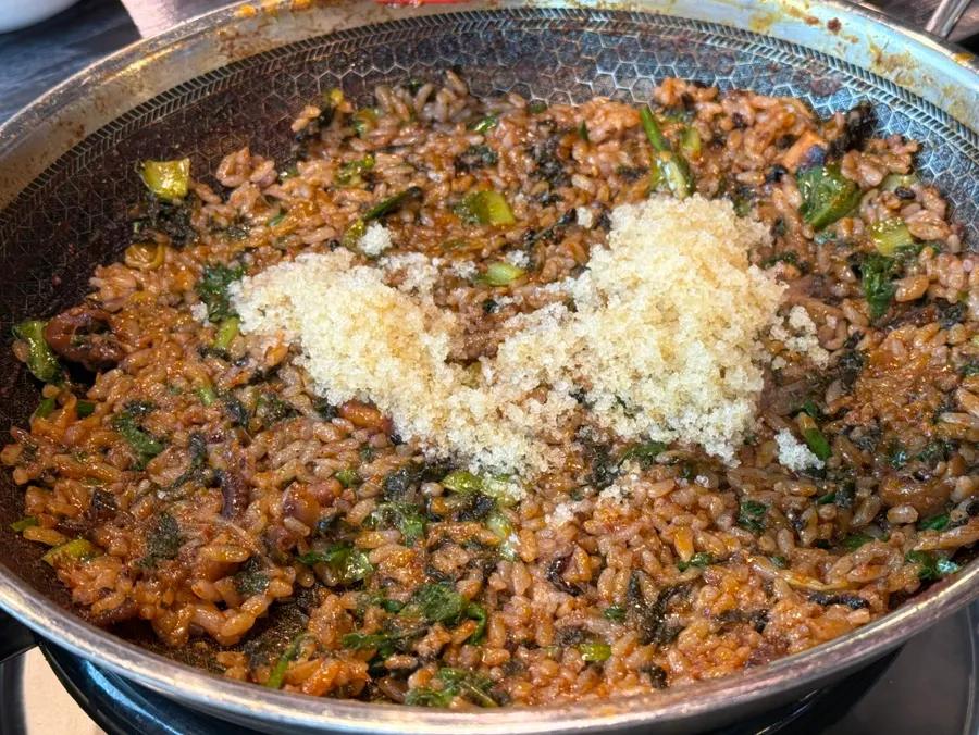 Flying fish roe fried rice being stir-fried