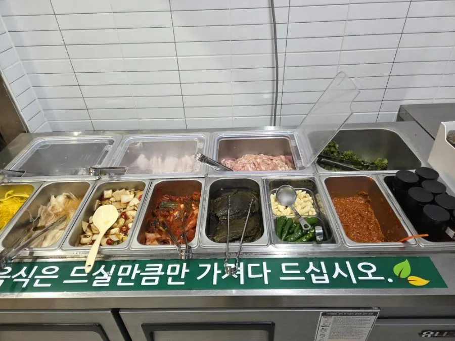Meat and eel laid out at the self-serve corner