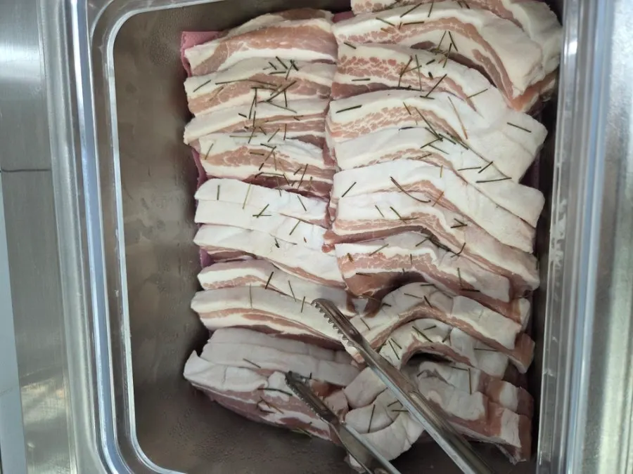 Eel and whole pork belly on the grill