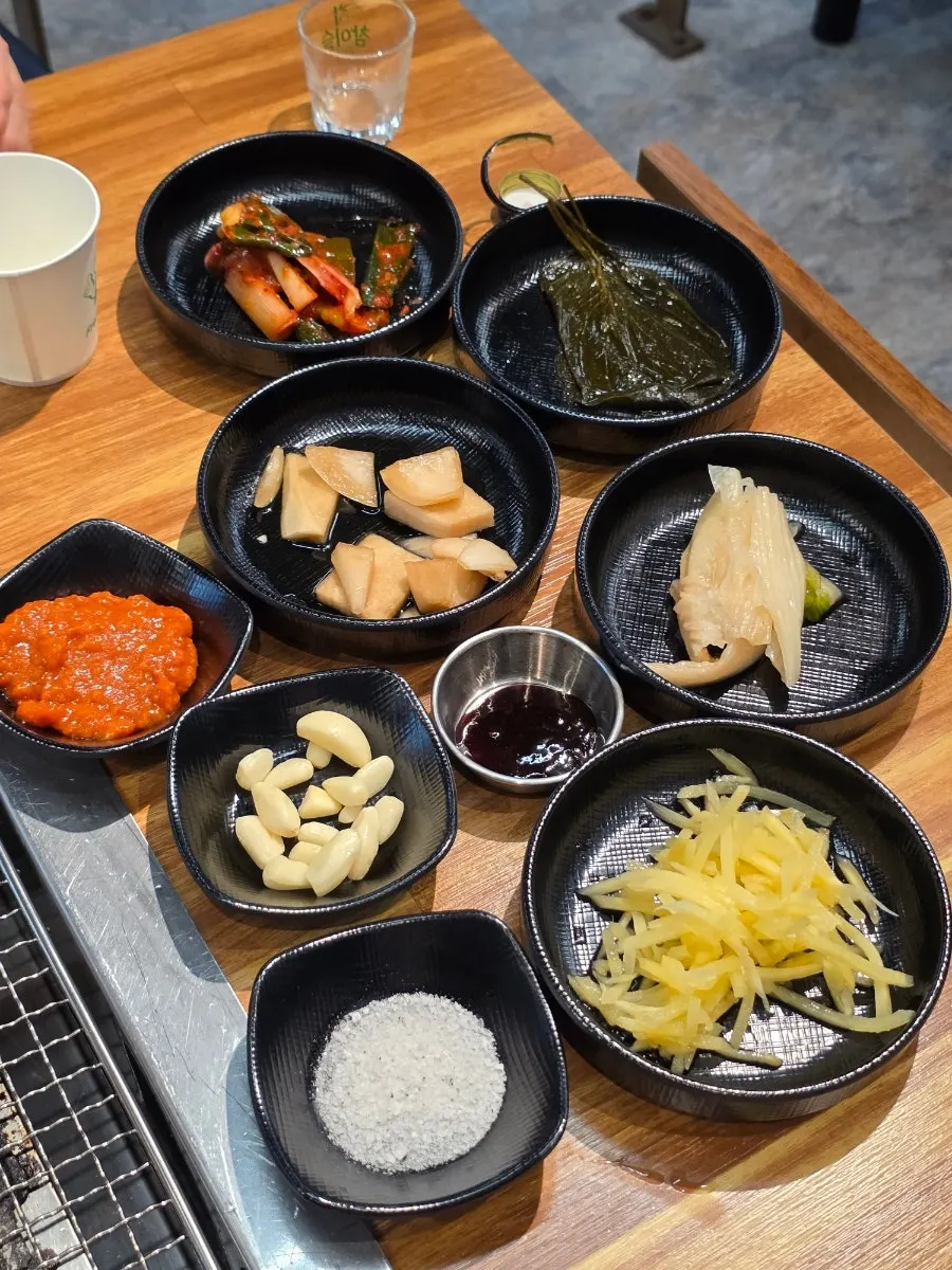 Complimentary bokbunja wine and basic side dishes