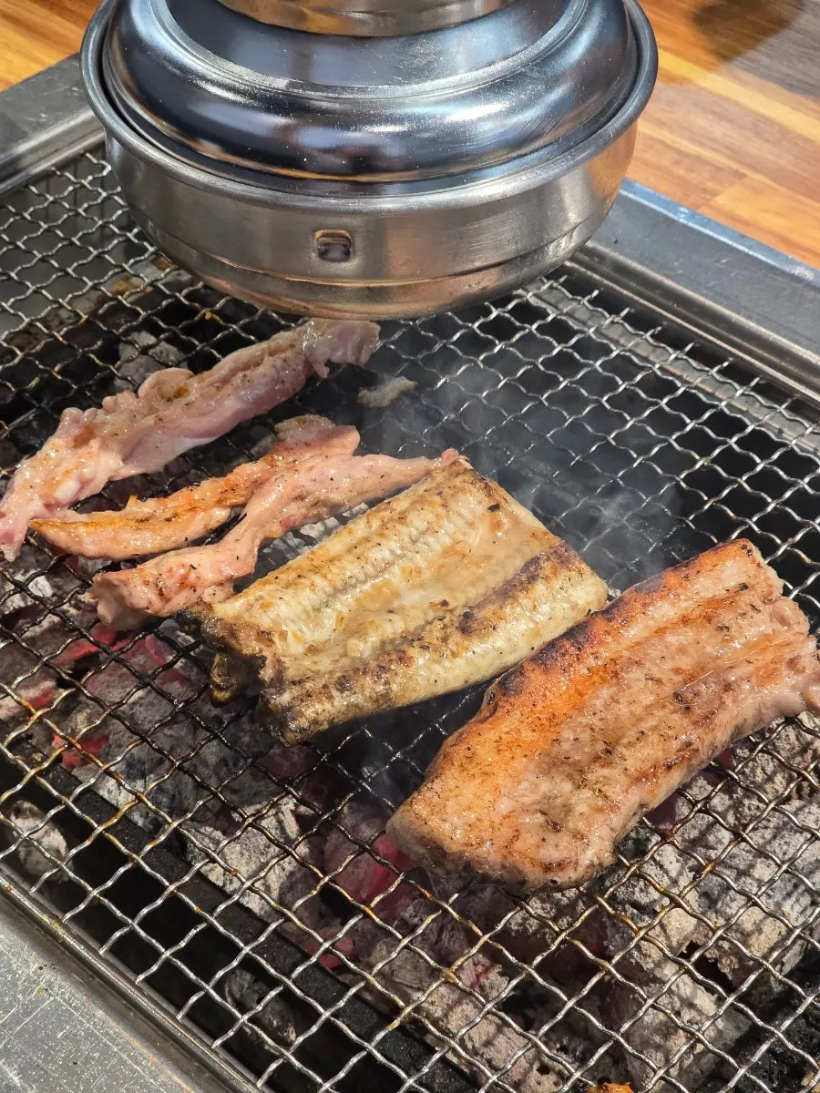 Eel turning golden over the charcoal