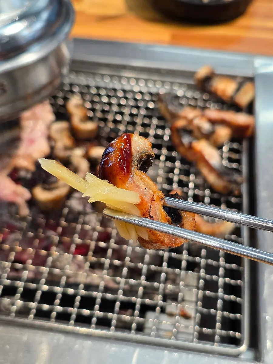Eel and side ingredients on the grill plate