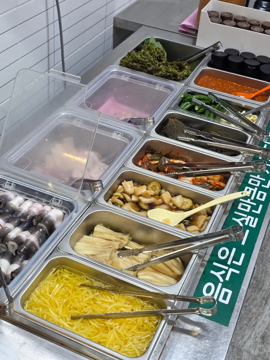 Fresh raw eel neatly arranged at the self-serve bar